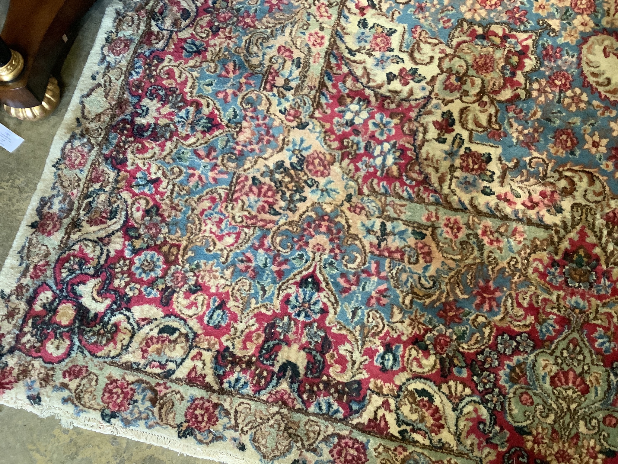 A large Tabriz ivory ground floral carpet, 500 x 300cm